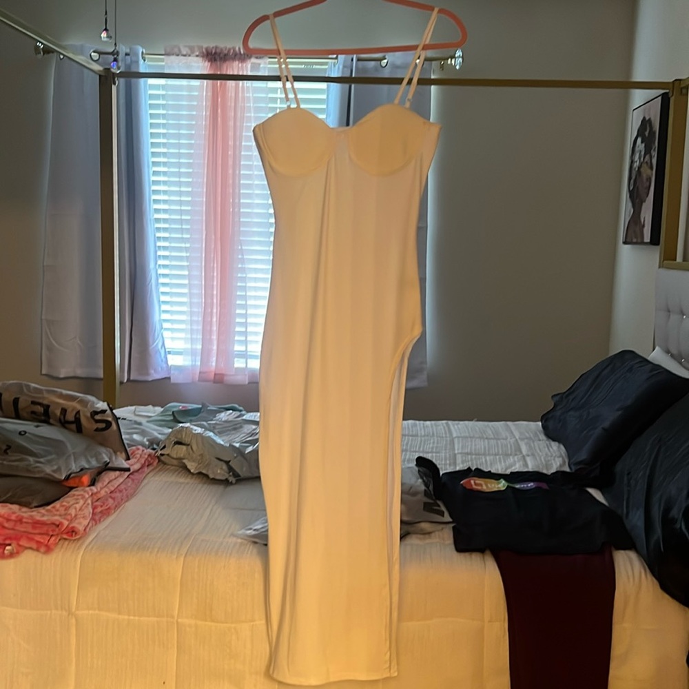 Off white spaghetti strap dress. High split on left leg (very high).